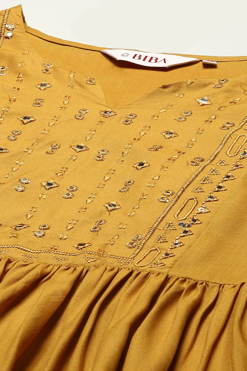 Mustard Rayon Short Solid Kurti image number 1