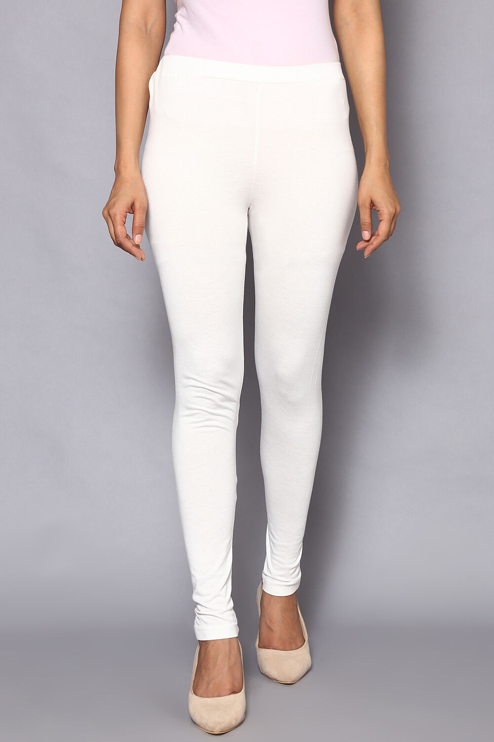 Buy Off White Viscose Lycra Solid Leggings Leggings for INR399