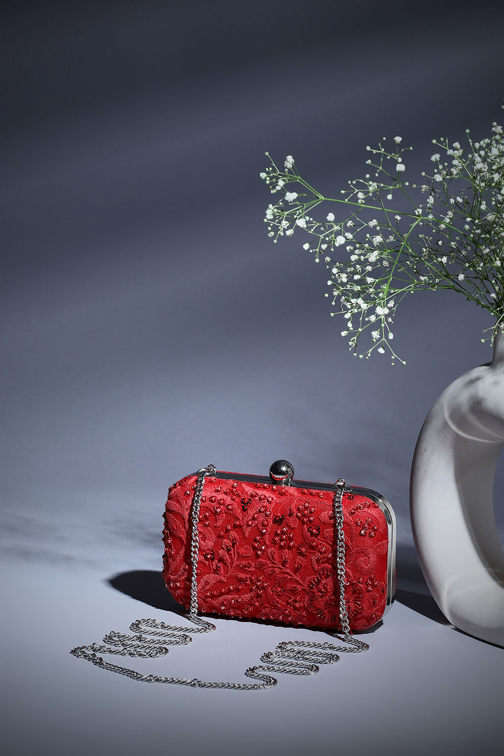 Red and silver clutch bag discount